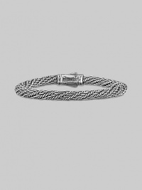 From the Kodiak Collection. A handsome, hand-woven herringbone braid of sterling silver with a bold carved clasp.6mm sterling silver braid Length, about 8½ Lobster clasp Made in USA