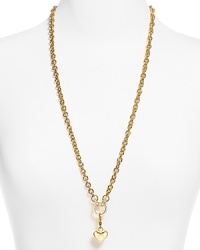 Charmed we're sure. Juicy Couture hits the links with this bold pendant necklace, crafted of plated metal and accented by a delicate heart-shaped pendant. Charmed we're sure. Juicy Couture hits the links with this bold pendant necklace, crafted of plated metal and accented by a delicate heart-shaped pendant.