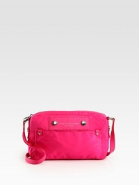 This compact nylon design is a chic way to protect your camera, finished with a signature logo plaque. Adjustable shoulder strap, 18-22 dropTop zip closureOne outside open pocketOne inside zip pocketTwo inside open pocketsFully lined9W X 6H X 1½DImportedPlease note: hardware color may vary. This compact nylon design is a chic way to protect your camera, finished with a signature logo plaque. Adjustable shoulder strap, 18-22 dropTop zip closureOne outside open pocketOne inside zip pocketTwo inside open pocketsFully lined9W X 6H X 1½DImportedPlease note: hardware color may vary.