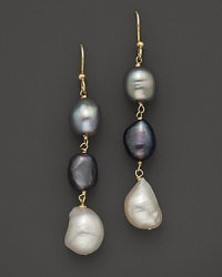 Baroque freshwater pearls glimmer in 14K. yellow gold settings. Baroque freshwater pearls glimmer in 14K. yellow gold settings.