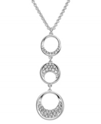 Modern and sophisticated, this pendant offers a beautiful interpretation of a timeless circle motif. Swarovski's fluid design complements a wide variety of outfits. Hanging on a rhodium-plated mixed metal chain, three circular elements are sprinkled with clear crystal pavé for extra sparkle. Approximate length: 15 inches + 2-inch extender. Approximate drop: 1 inches. Modern and sophisticated, this pendant offers a beautiful interpretation of a timeless circle motif. Swarovski's fluid design complements a wide variety of outfits. Hanging on a rhodium-plated mixed metal chain, three circular elements are sprinkled with clear crystal pavé for extra sparkle. Approximate length: 15 inches + 2-inch extender. Approximate drop: 1 inches.
