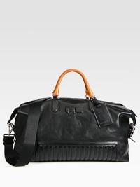 Quilted detail at the base adds a definitive touch to travel essential constructed in rich calfskin leather with contrasting gold handles for a modern feel.Zip closureDouble top handlesRemovable shoulder strapInterior pocketLeather20W x 11H x 9DImported Quilted detail at the base adds a definitive touch to travel essential constructed in rich calfskin leather with contrasting gold handles for a modern feel.Zip closureDouble top handlesRemovable shoulder strapInterior pocketLeather20W x 11H x 9DImported