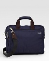 A soft briefcase fit for the streets, office and classroom alike in rugged denier canvas with a convenient laptop compartment and ripstop lining. Zip closure Exterior zip pocket Interior computer sleeve and organizing pockets Top handles, 4 drop Adjustable, detachable shoulder strap, about 44 15½W X 12H X 2D Imported 