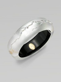 From the Lucite Star Dust Collection. A subtly textured bangle in a lustrous silver color, crafted of hand-sculpted, hand-painted Lucite, sprinkled with shimmering Swarovski crystals.LuciteCrystalDiameter, about 2¼Width, about ¾Hinged with magnetic claspMade in USA From the Lucite Star Dust Collection. A subtly textured bangle in a lustrous silver color, crafted of hand-sculpted, hand-painted Lucite, sprinkled with shimmering Swarovski crystals.LuciteCrystalDiameter, about 2¼Width, about ¾Hinged with magnetic claspMade in USA