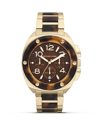 Tap this season's tortoise shell trend with this watch from MICHAEL Michael Kors. It's tonal face and bold bracelet perfect jet set chic, so wear it to give looks first class attitude. Tap this season's tortoise shell trend with this watch from MICHAEL Michael Kors. It's tonal face and bold bracelet perfect jet set chic, so wear it to give looks first class attitude.