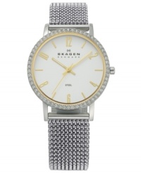 Silver and gold creates a sophisticated silhouette on this mesh bracelet watch by Skagen Denmark. Silver and gold creates a sophisticated silhouette on this mesh bracelet watch by Skagen Denmark.