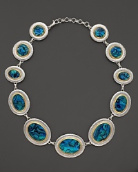 Paua shell lends exotic flair to this sterling silver and 24K gold statement necklace from Gurhan. Paua shell lends exotic flair to this sterling silver and 24K gold statement necklace from Gurhan.