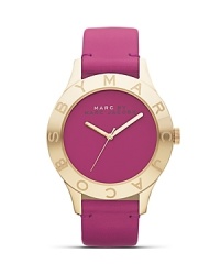 Perfect playful accessorizing with this purple timepiece from MARC BY MARC JACOBS. Accented by a soft leather strap with gold-detailing, it's a royal watch. Perfect playful accessorizing with this purple timepiece from MARC BY MARC JACOBS. Accented by a soft leather strap with gold-detailing, it's a royal watch.