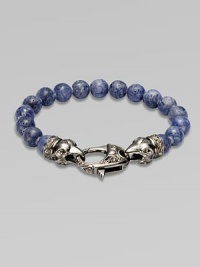 A new look for the modern man, handsomely crafted with a sterling silver raven's head clasp and a string of grey coral beads.Sterling silverLobster claspBracelet, 9 longAbout 3 diamImported A new look for the modern man, handsomely crafted with a sterling silver raven's head clasp and a string of grey coral beads.Sterling silverLobster claspBracelet, 9 longAbout 3 diamImported