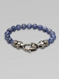 A new look for the modern man, handsomely crafted with a sterling silver raven's head clasp and a string of grey coral beads.Sterling silverLobster claspBracelet, 9 longAbout 3 diamImported