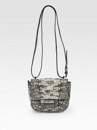 A compact shape of exotic Tejus lizard skin, blends artisan craftsmanship with a modern crossbody design.Adjustable crossbody strap, 23-27 drop Snap flap closure One outside zip pocket One inside zip pocket Two center compartments Leather lining 7W X 6H X 2½D Made in Italy A compact shape of exotic Tejus lizard skin, blends artisan craftsmanship with a modern crossbody design.Adjustable crossbody strap, 23-27 drop Snap flap closure One outside zip pocket One inside zip pocket Two center compartments Leather lining 7W X 6H X 2½D Made in Italy