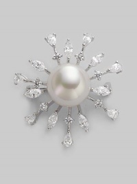 A shiny starburst with lustrous pearl center radiates with glimmering rhinestone rays. 14mm round white pearl Cubic zirconia Sterling silver Diameter, about 1½ Pin backing Made in Spain 