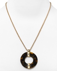 Tap into '70's-inspired elegance with this Lauren Ralph Lauren necklace, which flaunts retro allure with a tortoiseshell pendant. Tap into '70's-inspired elegance with this Lauren Ralph Lauren necklace, which flaunts retro allure with a tortoiseshell pendant.