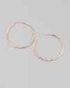 Slender hammered hoops of sterling silver and 18k gold, finished in the warm glow of 18k rose goldplating. An alloy of 18K gold and sterling silver plated with 18K rose gold Diameter, about 1¾ Post back Imported