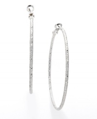 Simple hoops with a sweet dusting of sparkle. These Alfani hoops feature a simple design with a unique textured finish. Crafted in silver tone mixed metal. Approximate diameter: 2-1/8 inches. Simple hoops with a sweet dusting of sparkle. These Alfani hoops feature a simple design with a unique textured finish. Crafted in silver tone mixed metal. Approximate diameter: 2-1/8 inches.