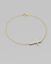 A gleaming 14k gold cross on a delicate chain.14k yellow gold Length, about 7 Pendant length, about ¾ Spring ring clasp Made in USA