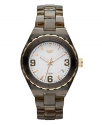 A sport watch that defines slick. Cambridge watch by adidas crafted of brown translucent plastic bracelet and round nylon case with gold tone and brown aluminum bezel. White grid-patterned dial features brown numerals at three, six and nine o'clock, gold tone stick indices, date window at four o'clock, three hands and logo. Quartz movement. Water resistant to 50 meters. Two-year limited warranty. A sport watch that defines slick. Cambridge watch by adidas crafted of brown translucent plastic bracelet and round nylon case with gold tone and brown aluminum bezel. White grid-patterned dial features brown numerals at three, six and nine o'clock, gold tone stick indices, date window at four o'clock, three hands and logo. Quartz movement. Water resistant to 50 meters. Two-year limited warranty.