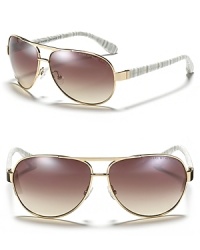 The classic aviator gets a stylish update with striated arms from MARC BY MARC JACOBS. The classic aviator gets a stylish update with striated arms from MARC BY MARC JACOBS.