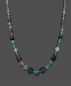 Add color to liven your look. Necklace features purple and green graduated, fluorite beads (6-16 mm) and a 14k gold clasp. Approximate length: 18 inches.