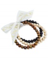 Beauty in bunches. Brown plays a starring role in this set of three cultured freshwater pearl (7-8 mm) stretch bracelets that offer a classic chic feel, with crystals adding luster. Approximate length: 7-1/2 inches.