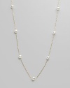 From the Akoya Collection. A delicate chain, enhanced with lustrous white cultured Akoya pearls. 6mm white, round cultured pearls Quality: AA 18k yellow gold Length, about 32 Spring ring clasp Imported