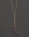 Twin amethyst briolettes sparkle from this 14K yellow gold lariat necklace.
