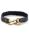 Leather and brasstone hardware bring a city edge to this canvas bracelet from Caputo.