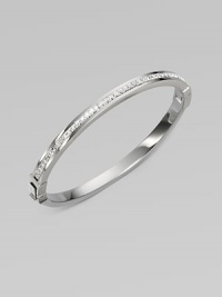 A narrow design that sparkles with a row of dazzling clear rhinestones. RhinestonesSilvertone steelDiameter, about 2¾Hinged, push lock closureImported A narrow design that sparkles with a row of dazzling clear rhinestones. RhinestonesSilvertone steelDiameter, about 2¾Hinged, push lock closureImported