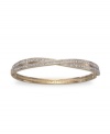 All the sparkle you love, with a twist. This stunning Swarovski bangle shines with clear crystal pave set in two bands of gold-plated mixed metal crossed at center. Approximate diameter: 3-1/4 inches.