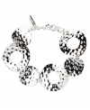 For style that's flexible and flauntable -- just add this chic circular style by Nine West. Crafted in silver tone mixed metal, interlocking circles shine with textured edges. Approximate length: 7-1/4 inches.