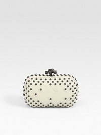 A gorgeous frame-top leather bag, finished with woven and stud details and a chic top knot clasp.Top clasp closureSuede lining7½W X 4¾H X 3/4DMade in Italy A gorgeous frame-top leather bag, finished with woven and stud details and a chic top knot clasp.Top clasp closureSuede lining7½W X 4¾H X 3/4DMade in Italy