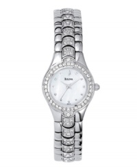 A shining example of good taste. This elegant timepiece features a crystal bezel and a stainless steel bracelet and case. White mother of pearl dial with logo and crystal markers. 3-hand movement. Water resistant to 30 meters. Three-year limited warranty. A shining example of good taste. This elegant timepiece features a crystal bezel and a stainless steel bracelet and case. White mother of pearl dial with logo and crystal markers. 3-hand movement. Water resistant to 30 meters. Three-year limited warranty.
