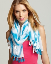 Add a touch of bright whimsy to any outfit with this oblong scarf in a turquoise and white Ikat pattern. Add a touch of bright whimsy to any outfit with this oblong scarf in a turquoise and white Ikat pattern.