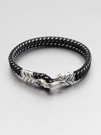 Add a simple touch of refined masculinity to your casual wardrobe with this braided cord design accented with a chevron clasp of sterling silver.Sterling silverChevron claspAbout 9 diam.Made in USA Add a simple touch of refined masculinity to your casual wardrobe with this braided cord design accented with a chevron clasp of sterling silver.Sterling silverChevron claspAbout 9 diam.Made in USA
