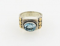 Sterling Silver and Blue Topaz Ring with 18 Karat Gold Accent Size 9 Sterling Silver and Blue Topaz Ring with 18 Karat Gold Accent Size 9