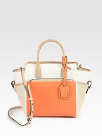 Colorblocked top-handle design of smooth glovetan leather and super-chic canvas. Double top handles, 4¼ dropRemovable, adjustable shoulder strap, 21-22½ dropFront pocket with removable zip pouchTwo open side pocketsBack slide pocketTwo inside zip pocketsInner zip pouchCotton lining9¾W X 9½H X 4¾DImported Colorblocked top-handle design of smooth glovetan leather and super-chic canvas. Double top handles, 4¼ dropRemovable, adjustable shoulder strap, 21-22½ dropFront pocket with removable zip pouchTwo open side pocketsBack slide pocketTwo inside zip pocketsInner zip pouchCotton lining9¾W X 9½H X 4¾DImported