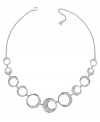 A modern and sophisticated interpretation of a timeless circle motif. Swarovski's fluid design complements a wide variety of outfits. Hanging on a rhodium-plated mixed metal chain, the circular elements are sprinkled with clear crystal pavé for extra sparkle. Approximate length: 17 inches + 2-inch extender.