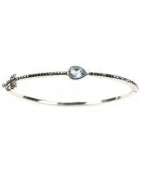 Layer-able style that adds a touch of shimmer. Judith Jack's thin, stackable bangle features a pear-cut blue topaz (1/4 ct. t.w.) and glittering marcasite in sterling silver. Approximate diameter: 2-3/8 inches. Layer-able style that adds a touch of shimmer. Judith Jack's thin, stackable bangle features a pear-cut blue topaz (1/4 ct. t.w.) and glittering marcasite in sterling silver. Approximate diameter: 2-3/8 inches.
