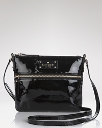 Compact style gets glossy with this coated leather crossbody bag from kate spade new york. Sized to slip across the body, this bag is a small way to add major shine. Compact style gets glossy with this coated leather crossbody bag from kate spade new york. Sized to slip across the body, this bag is a small way to add major shine.