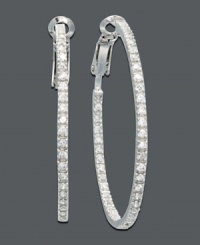 Easy glamour and effortless style. Sparkling cubic zirconia hoops by B. Brilliant add instant twinkle for an evening out on the town. Crafted in sterling silver. Approximate diameter: 1-5/8 inches. Easy glamour and effortless style. Sparkling cubic zirconia hoops by B. Brilliant add instant twinkle for an evening out on the town. Crafted in sterling silver. Approximate diameter: 1-5/8 inches.