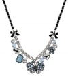 Float into the season with enchanting colors. Betsey Johnson's frontal necklace displays a silver tone butterfly with blue-colored crystal accents, silver tone bubble hearts, rectangular crystal gems, flower with blue-colored crystals, glass pearls, blue faceted beads and black ribbons. Set in rhodium-plated mixed metal with black grosgrain ribbon. Approximate length: 16 inches + 3-inch extender. Approximate drop: 1-1/4 inches.