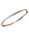 Capture the must-have trend of the season with simple style in caramel color. Bangle features a subtle twist and textured finish in chic 14k rose gold. Approximate diameter: 2-3/8 inches.