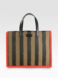 A structured design in striped canvas with contrast trim and leather accents.Double leather top handles, 5½ dropOpen topOne inside zip pouchLinen lining14¼W X 11H X 6DMade in Italy A structured design in striped canvas with contrast trim and leather accents.Double leather top handles, 5½ dropOpen topOne inside zip pouchLinen lining14¼W X 11H X 6DMade in Italy