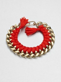 A chunky chain, with the look of a vintage ID bracelet, is modernized with bright red braiding with tassels and a fun paper-clip clasp.GoldplatedCottonLength, about 7.5Spring ring paper clip claspMade in France A chunky chain, with the look of a vintage ID bracelet, is modernized with bright red braiding with tassels and a fun paper-clip clasp.GoldplatedCottonLength, about 7.5Spring ring paper clip claspMade in France