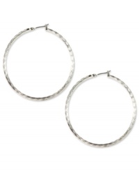 No accessory wardrobe is complete without a fabulous pair of hoop earrings, like these silver tone stunners from Anne Klein. The textured detailing adds an instant update to a classic look. Crafted in imitation rhodium mixed metal. Approximate diameter: 2 inches. No accessory wardrobe is complete without a fabulous pair of hoop earrings, like these silver tone stunners from Anne Klein. The textured detailing adds an instant update to a classic look. Crafted in imitation rhodium mixed metal. Approximate diameter: 2 inches.