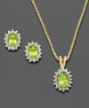 This set, consisting of earrings and a matching pendant, will lend chic sophistication to your everyday style. Victoria Townsend's design is inspired by royalty with exquisite oval-shaped peridots (1-3/4 ct. t.w.) flanked by sparkling diamond accents. Set in 18k gold over sterling silver. Approximate length: 18 inches. Approximate pendant drop: 5/8 inch. Approximate earring diameter: 3/8 inch.