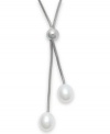 Three cultured freshwater pearls (9 mm) add shimmer to this lovely lariat-style necklace. Set in sterling silver. Approximate length: 19-1/2 inches. Approximate drop: 1-1/2 inches.