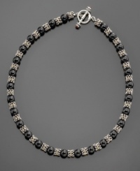 Sultry black onyx beads (8.5-9mm) swathed in sterling silver and 14k gold accents give your neckline glitter. Necklace measures 18. Sultry black onyx beads (8.5-9mm) swathed in sterling silver and 14k gold accents give your neckline glitter. Necklace measures 18.