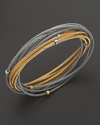 18K yellow and white gold stations accent this mix of cable bangles from Charriol. 18K yellow and white gold stations accent this mix of cable bangles from Charriol.