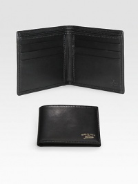 Leather bi-fold wallet accented with Made in Italy by Gucci script gold engraving. Two bill compartmentsSix card slotsClosed: 4.3W x 3.5H x .6DOpen: 8.4W x 3.5HMade in Italy Leather bi-fold wallet accented with Made in Italy by Gucci script gold engraving. Two bill compartmentsSix card slotsClosed: 4.3W x 3.5H x .6DOpen: 8.4W x 3.5HMade in Italy